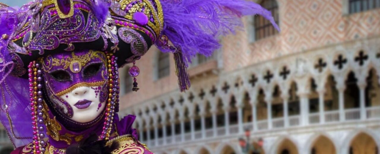 Venetian Carnival masks and costumed figures in Venice during Carnevale, Italy, celebrating tradition and festivity.