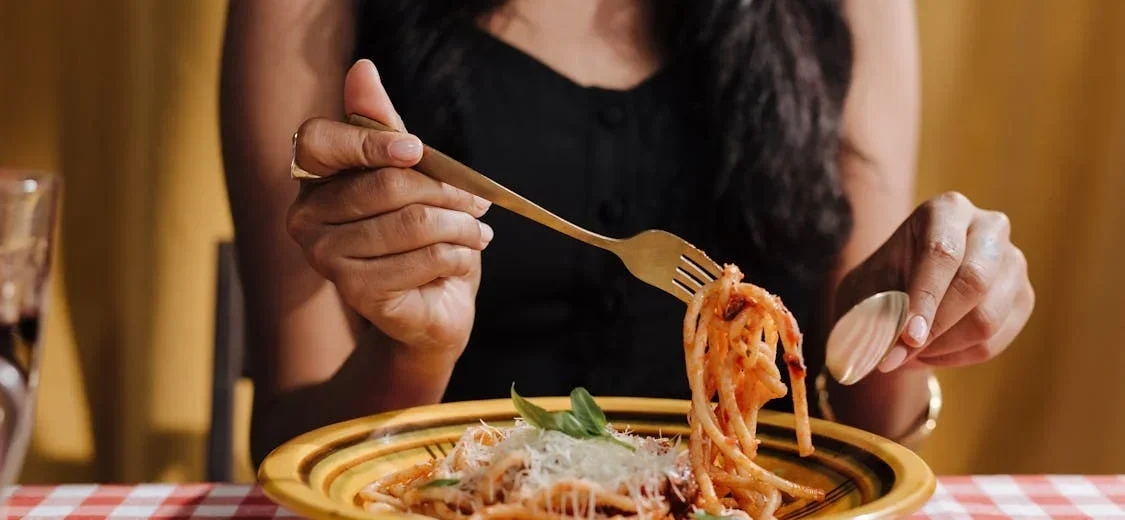 Enjoying authentic Italian pasta during a food experience in Italy. food tour vs cooking class