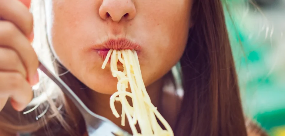 woman eating pasta