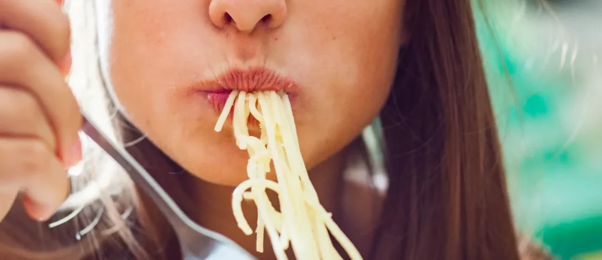 woman eating pasta