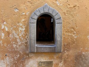 Traditional wine window in Florence Italy featured during authentic Florence food tour experience