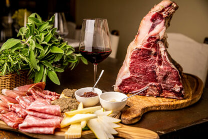 Bistecca alla Fiorentina with Tuscan wine and local specialties on authentic Florence and wine tour