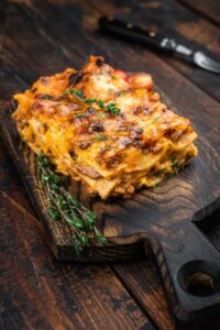 homemade Italian lasagna with ritch meat sauce, creamy bechamel and melted cheese