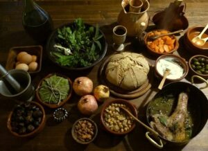 Typical foods eaten in ancient Rome including bread, vegetables herbs and eggs